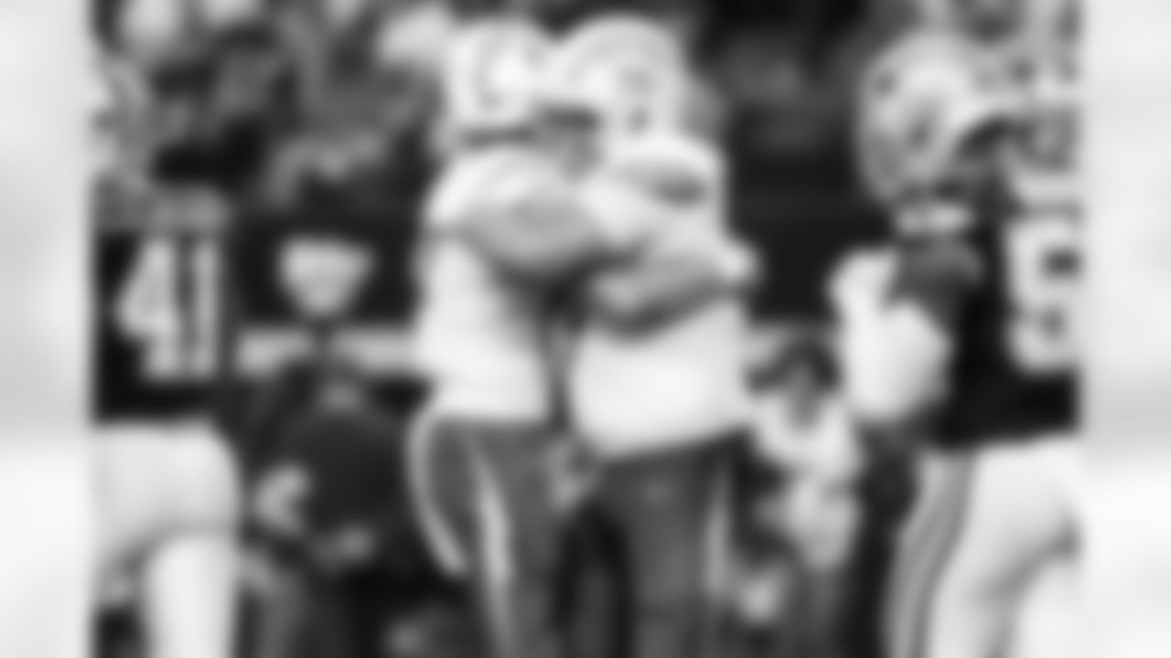 QB Justin Herbert (10) and C Bradley Bozeman (75)