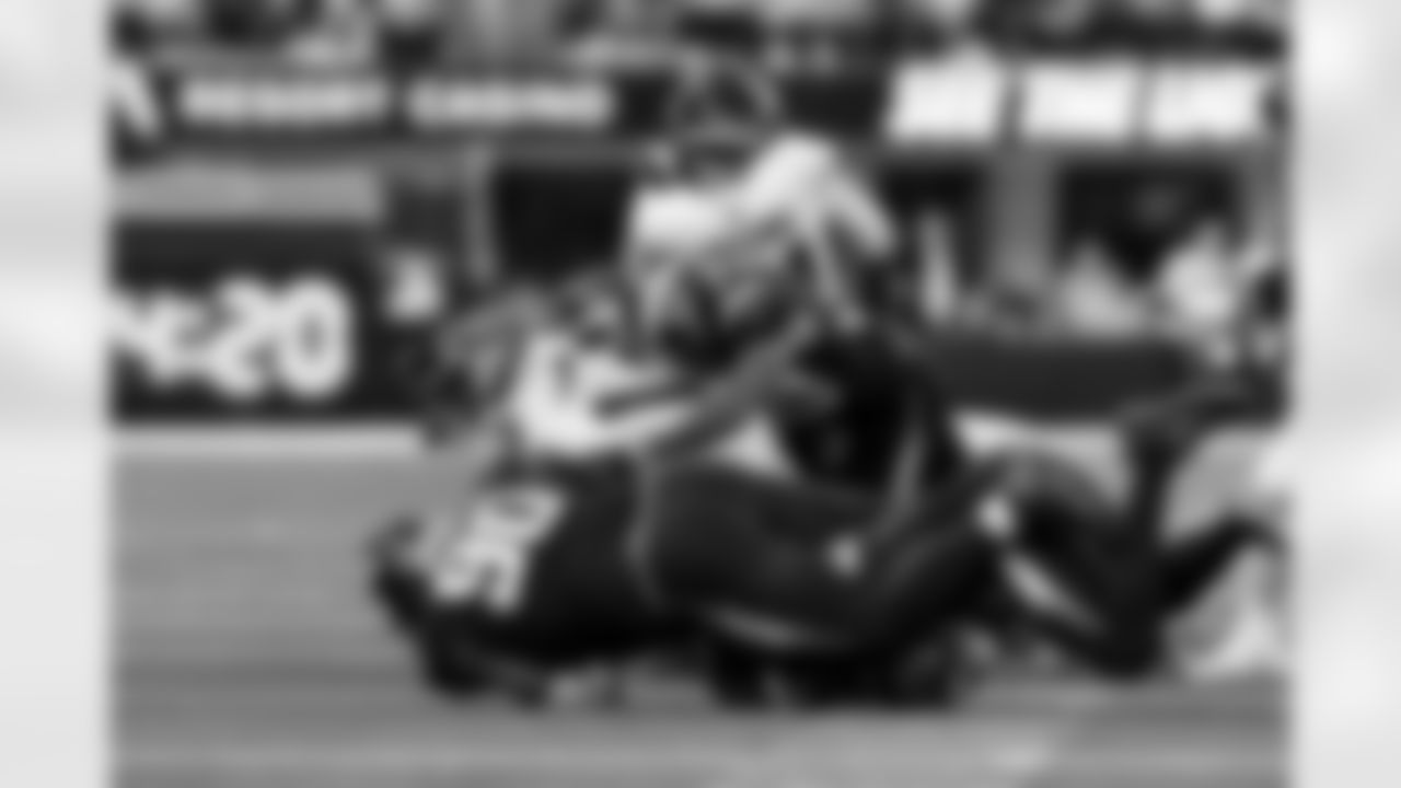 LB Daiyan Henley (0), LB Del'Shawn Phillips (53) and DL Teair Tart (90)