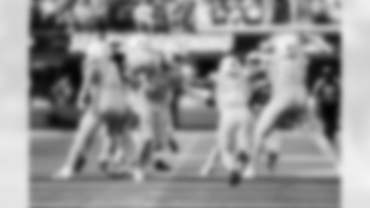 QB Justin Herbert (10) and RB Kimani Vidal (30)