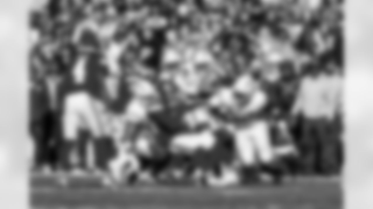 OLB Khalil Mack (52) and LB Daiyan Henley (0)