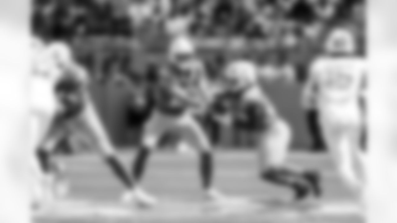 QB Justin Herbert (10) and RB Kimani Vidal (30)