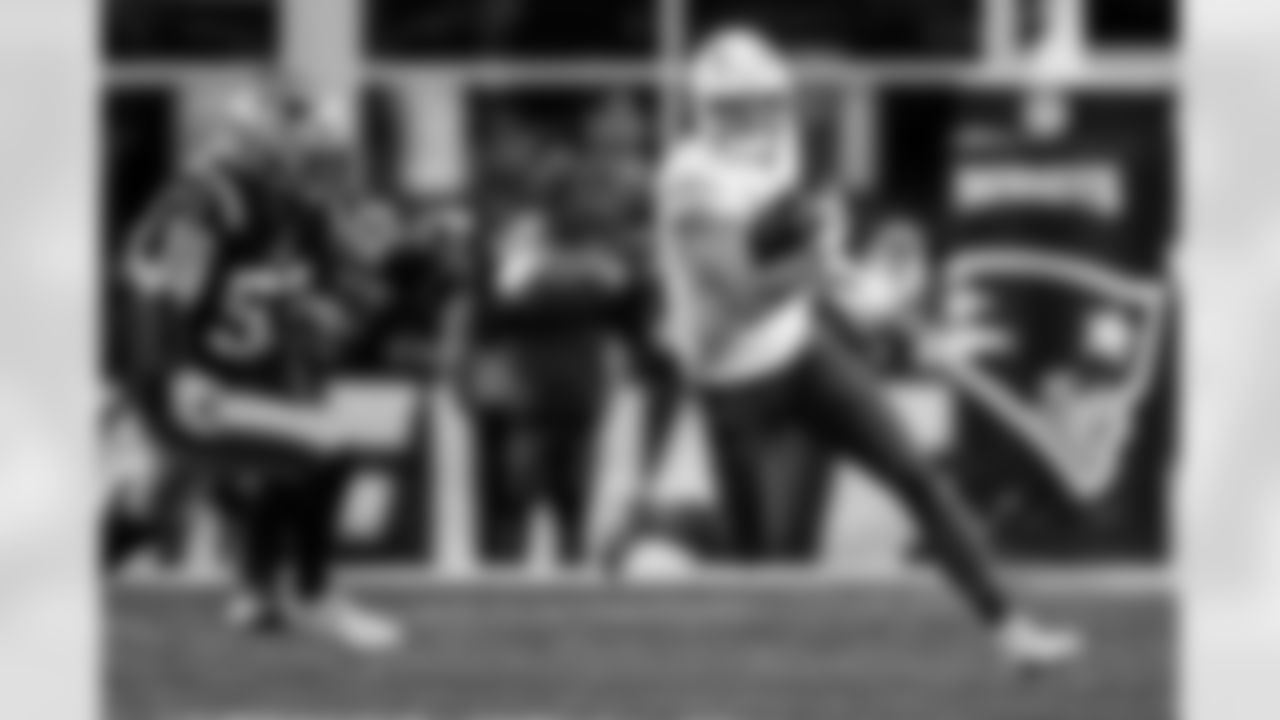 Check out the best shots from the Chargers Wild Card matchup against the Patriots!