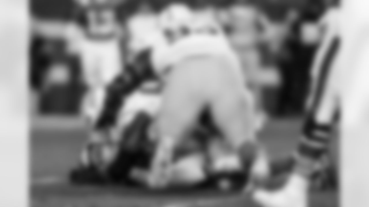 OLB Odafe Oweh (98) and DL Otito Ogbonnia (93)