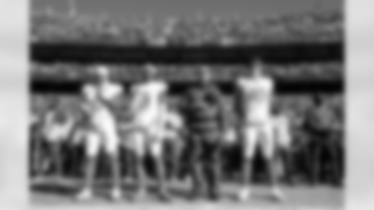 LB Daiyan Henley (0), S Derwin James Jr. (3), Head Coach Jim Harbaugh and QB Justin Herbert (10)