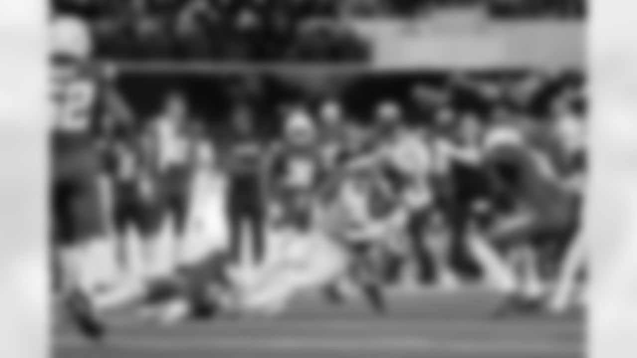 CB Cam Hart (20) and LB Daiyan Henley (0)