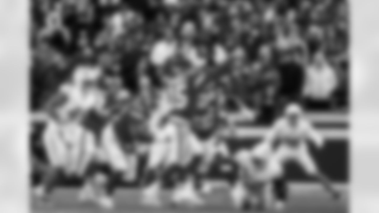 OLB Tuli Tuipulotu (45) and OLB Khalil Mack (52)