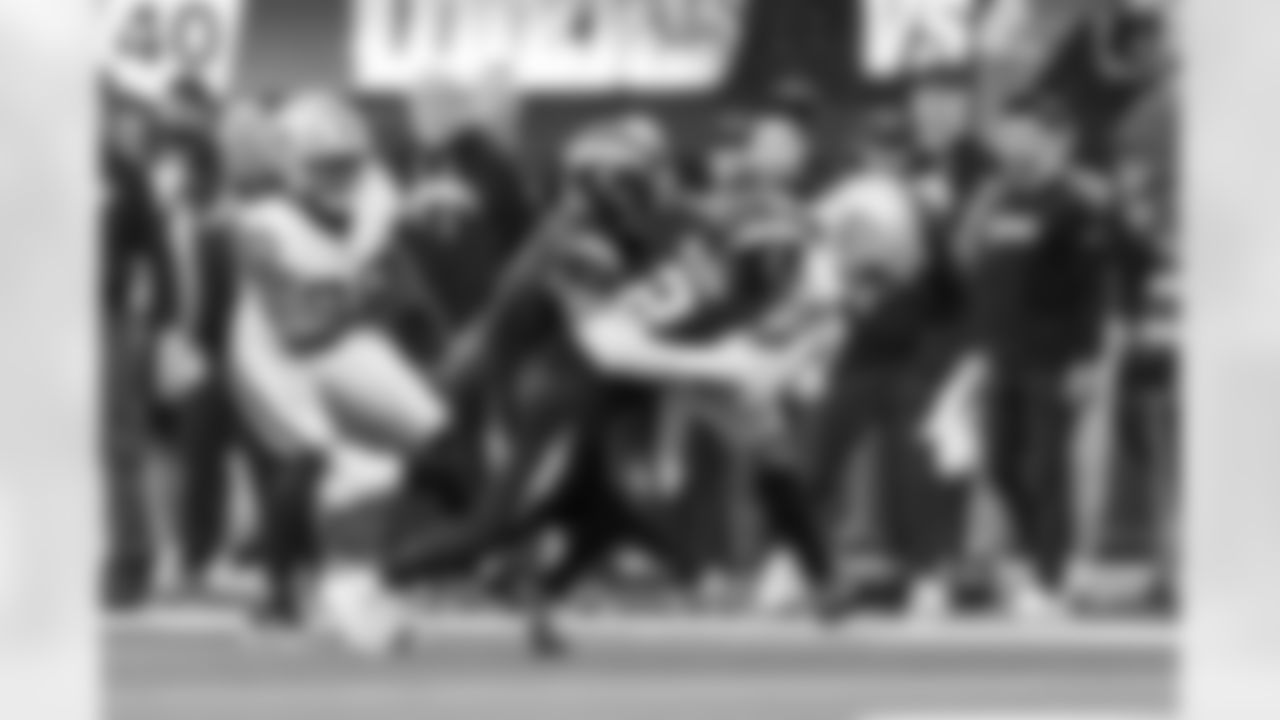 DB Elijah Molden (2) and LB Daiyan Henley (0)