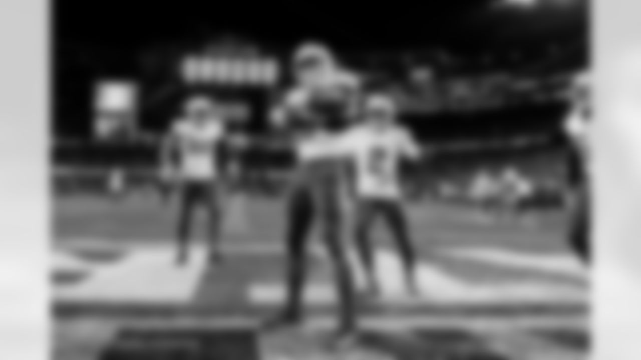 Check out the best shots from the Chargers Wild Card matchup against the Patriots!