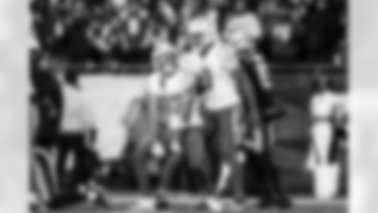 DB Deane Leonard (33) and WR Tre Harris (9)