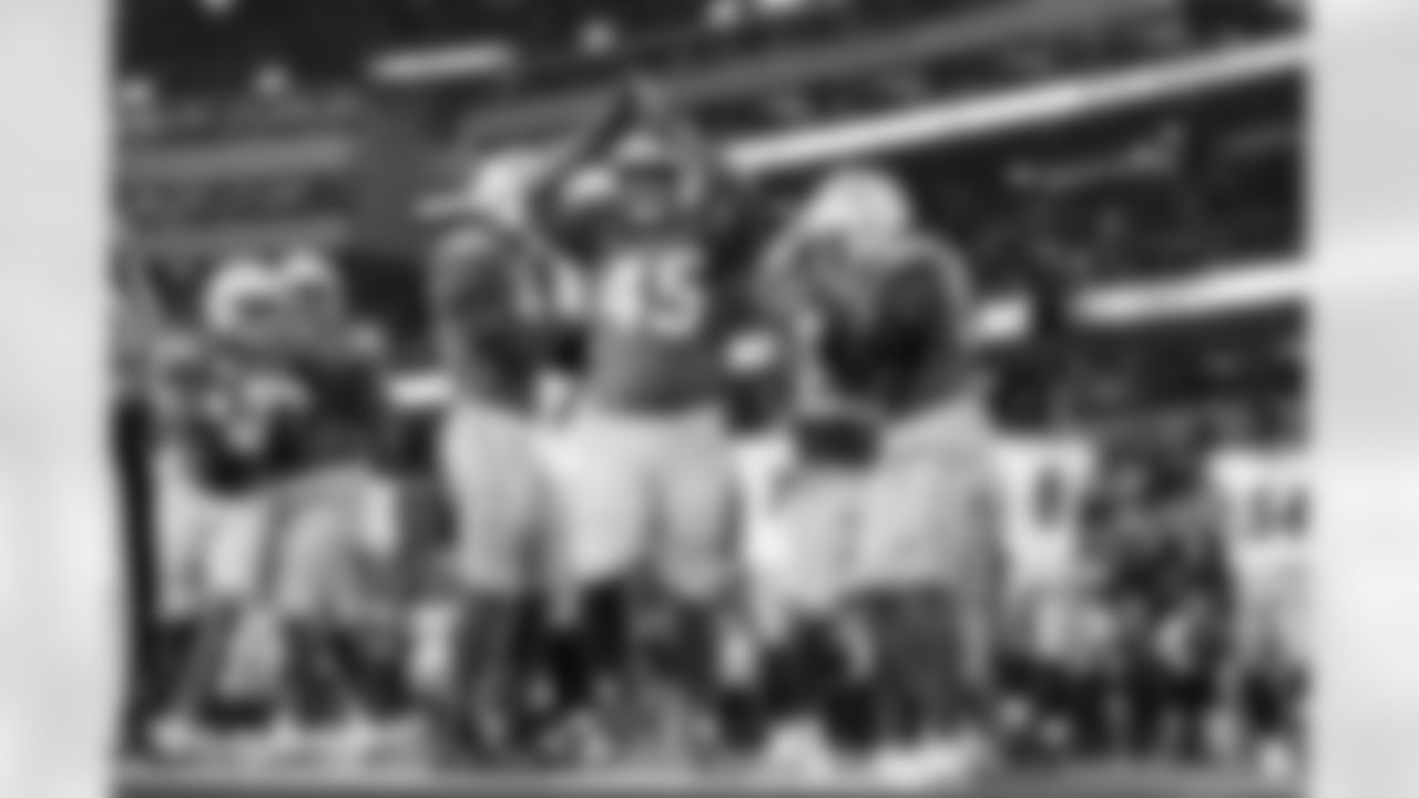 OLB Tuli Tuipulotu (45) and OLB Khalil Mack (52)