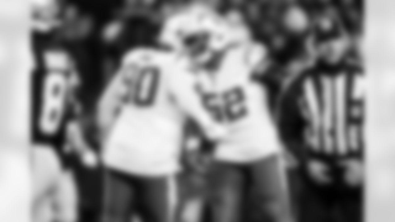 DL Teair Tart (90) and OLB Khalil Mack (52)