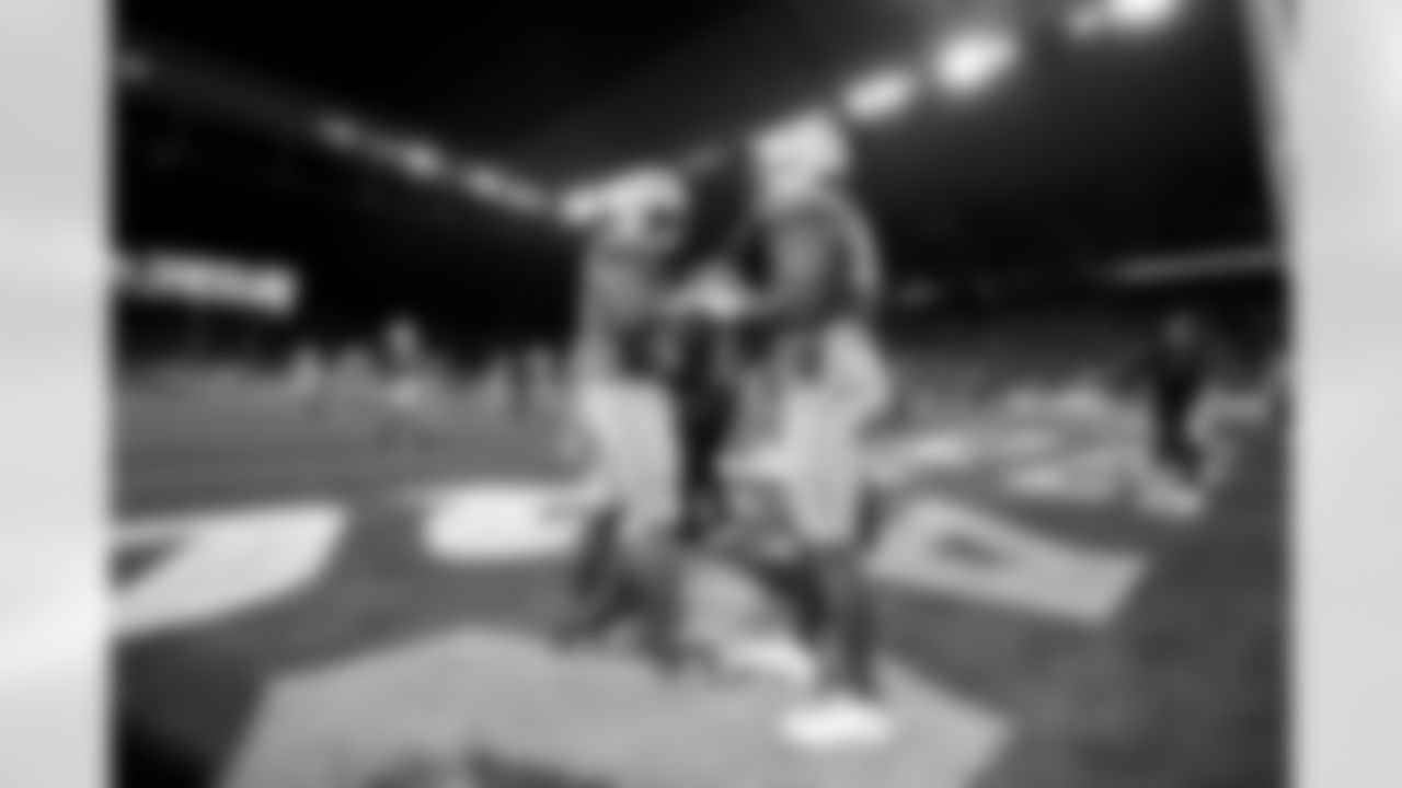 OLB Tuli Tuipulotu (45) and OLB Khalil Mack (52)
