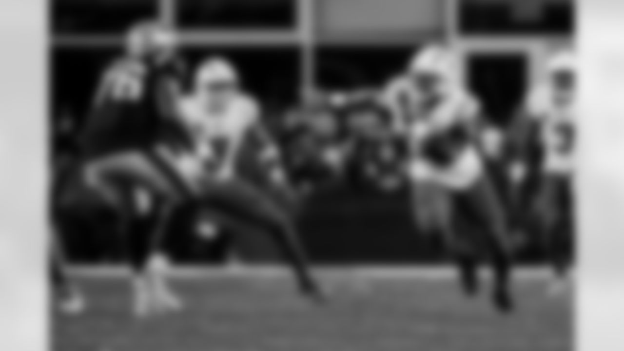 Check out the best shots from the Chargers Wild Card matchup against the Patriots!