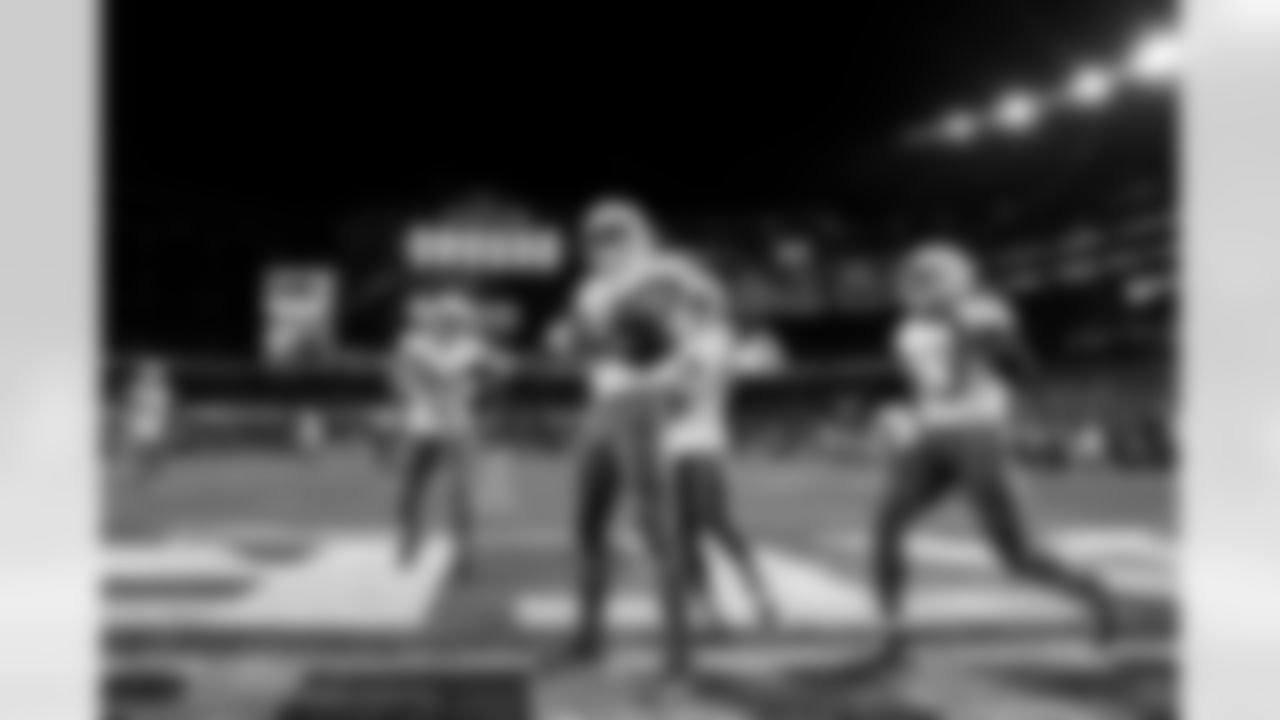 LB Daiyan Henley (0), LB Del'Shawn Phillips (53), DB Elijah Molden (2) and OLB Khalil Mack (52)