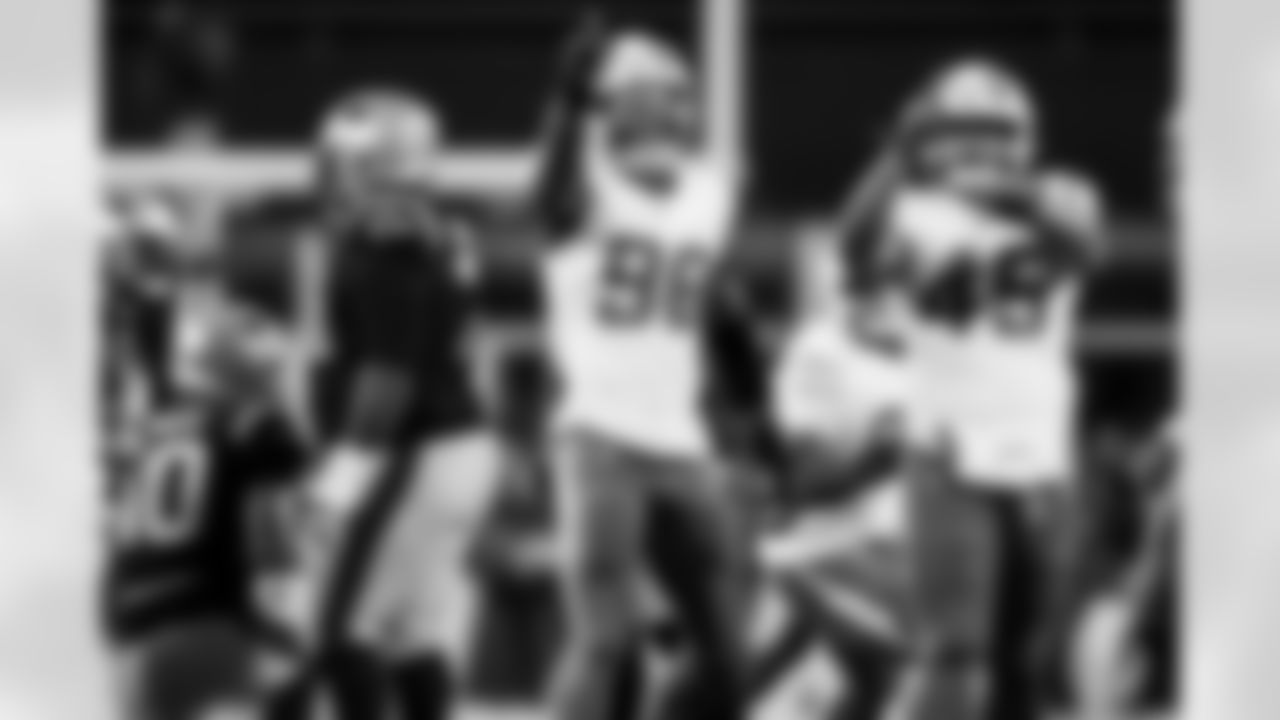 OLB Tuli Tuipulotu (45) and OLB Odafe Oweh (98)