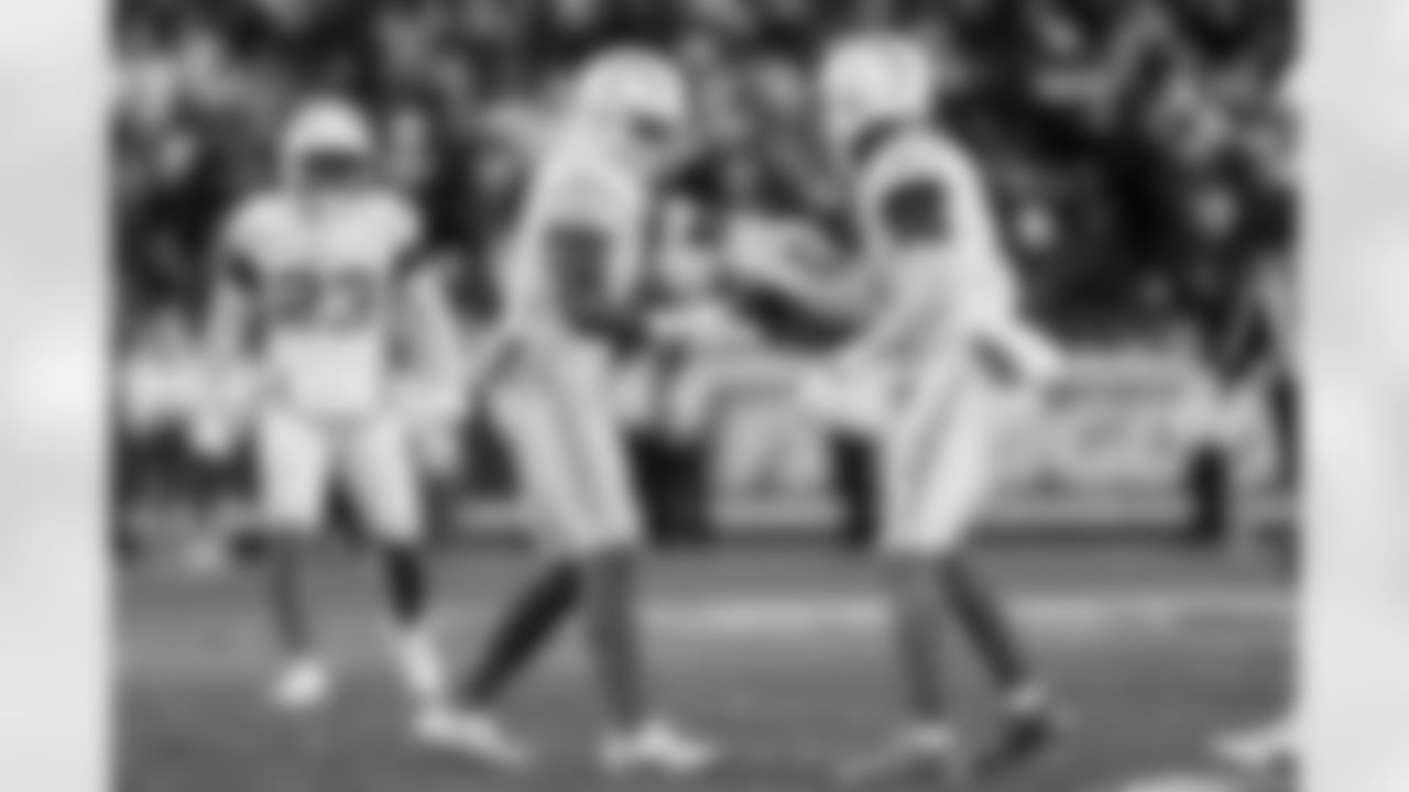 LB Daiyan Henley (0) and S Derwin James Jr. (3)