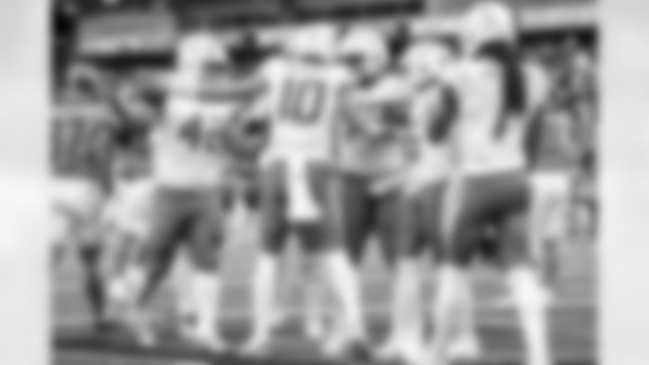 TE Tucker Fisk (42) and QB Justin Herbert (10)