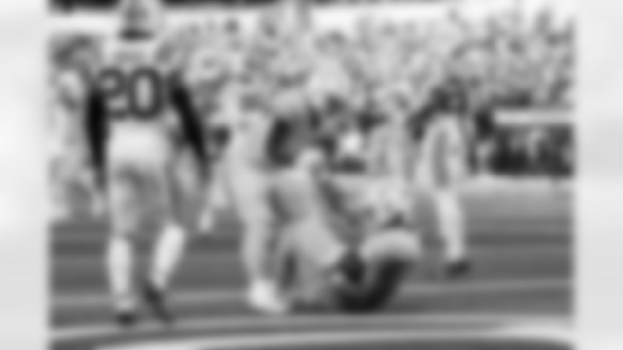 RB Hassan Haskins (28) and TE Oronde Gadsden (86)
