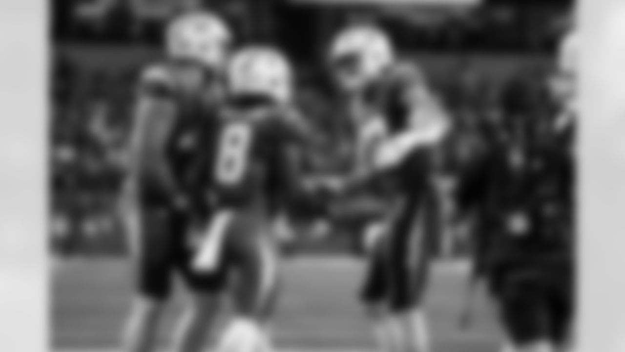 RB Omarion Hampton (8) and QB Justin Herbert (10)