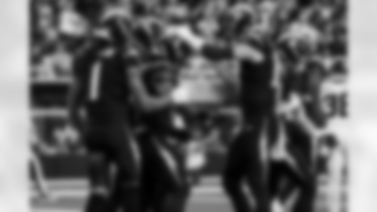 RB Omarion Hampton (8) and QB Justin Herbert (10)