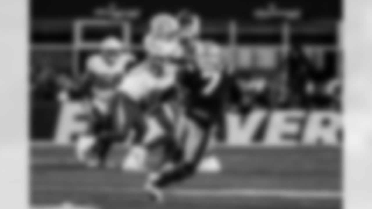 Check out the best shots from the Chargers Wild Card matchup against the Patriots!