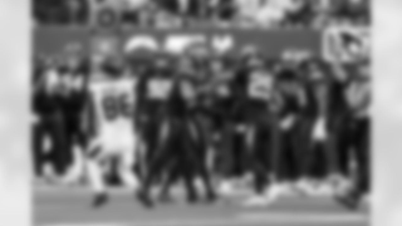 LB Daiyan Henley (0) and CB Tarheeb Still (29)