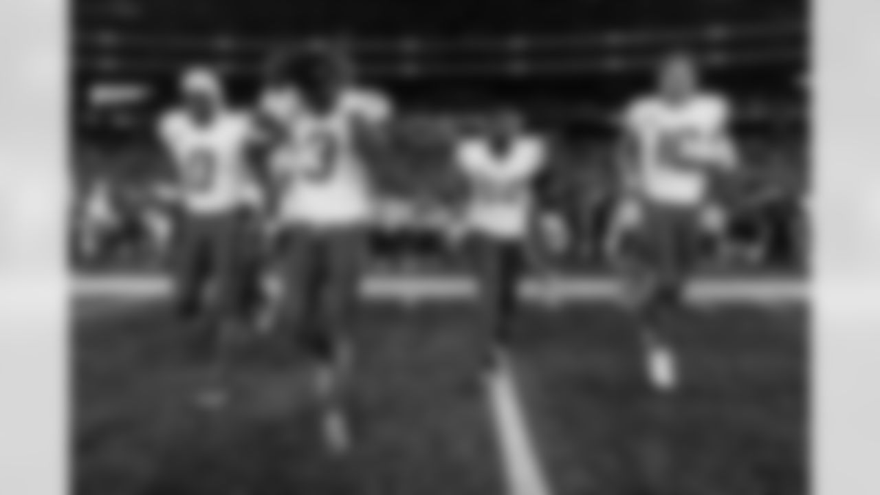 Check out the best shots from the Chargers Wild Card matchup against the Patriots!