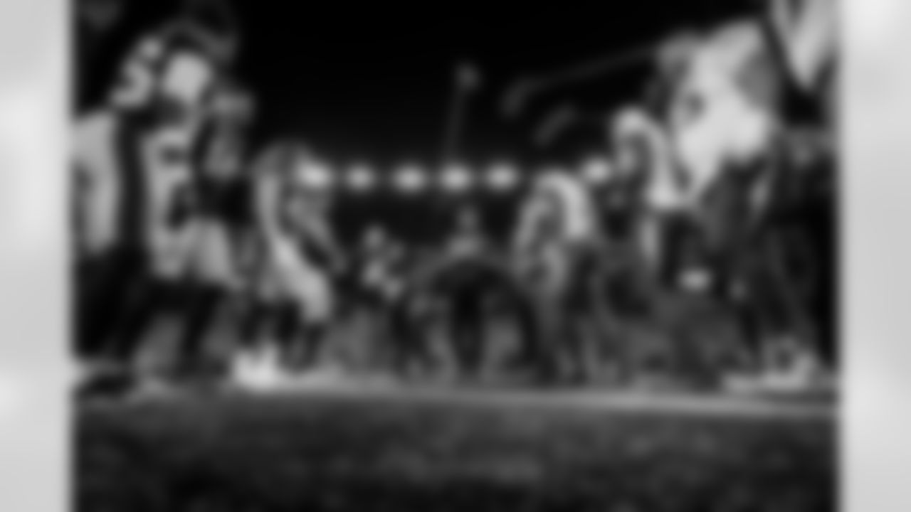 Check out the best shots from the Chargers Wild Card matchup against the Patriots!