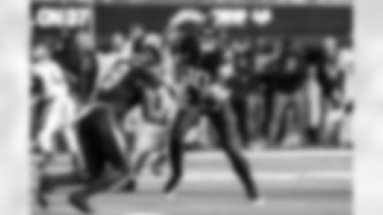 RB Omarion Hampton (8) and QB Justin Herbert (10)