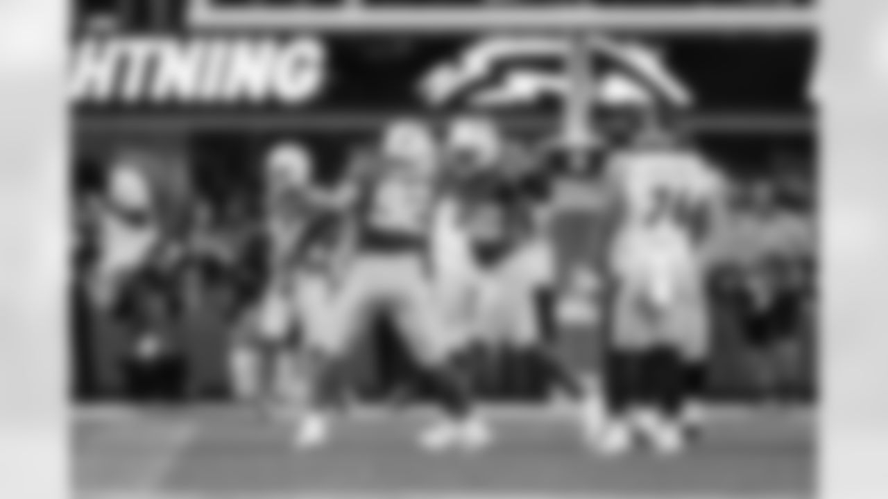 DL Justin Eboigbe (92) and OLB Khalil Mack (52)