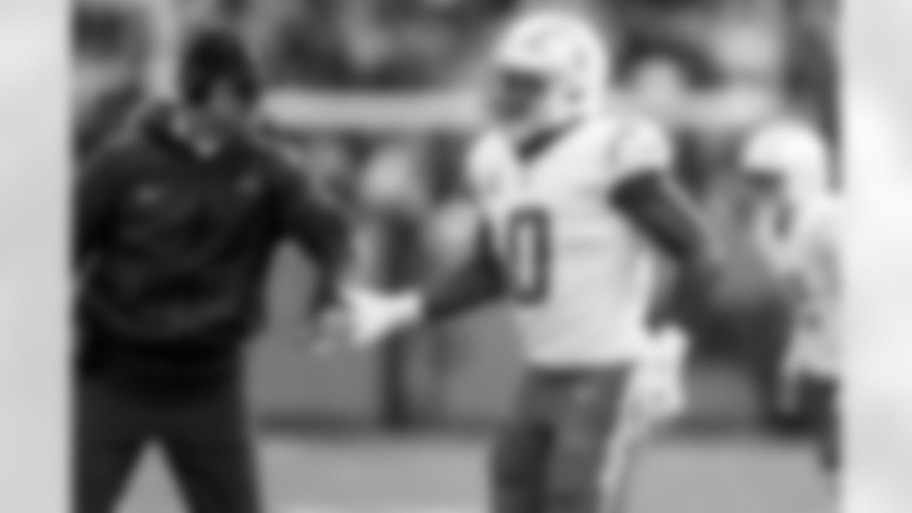 Head Coach Jim Harbaugh and LB Daiyan Henley (0)