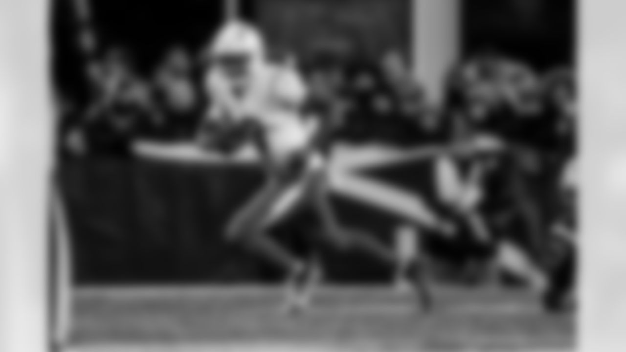 Check out the best shots from the Chargers Wild Card matchup against the Patriots!