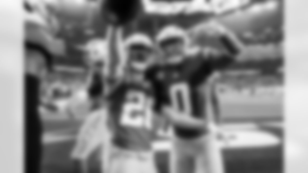 LB Daiyan Henley (0) and CB Donte Jackson (26)