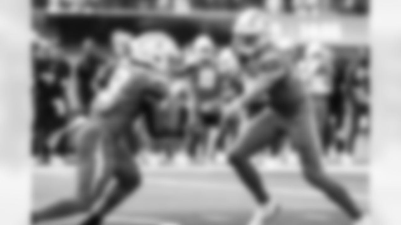 RB Omarion Hampton (8) and QB Justin Herbert (10)