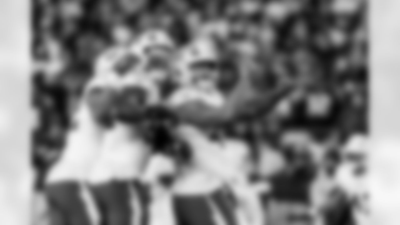 Check out the best shots from the Chargers Wild Card matchup against the Patriots!