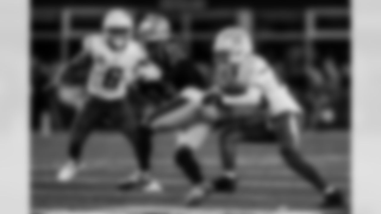 Check out the best shots from the Chargers Wild Card matchup against the Patriots!