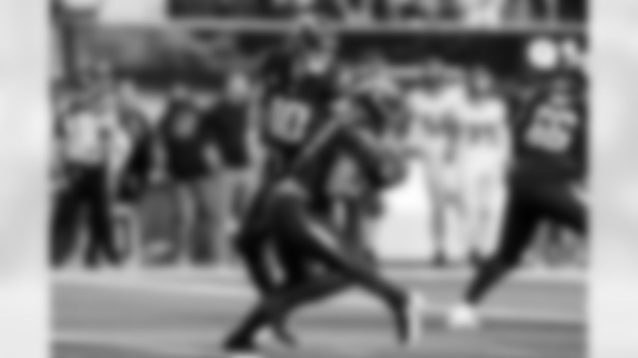 QB Justin Herbert (10) and RB Omarion Hampton (8)