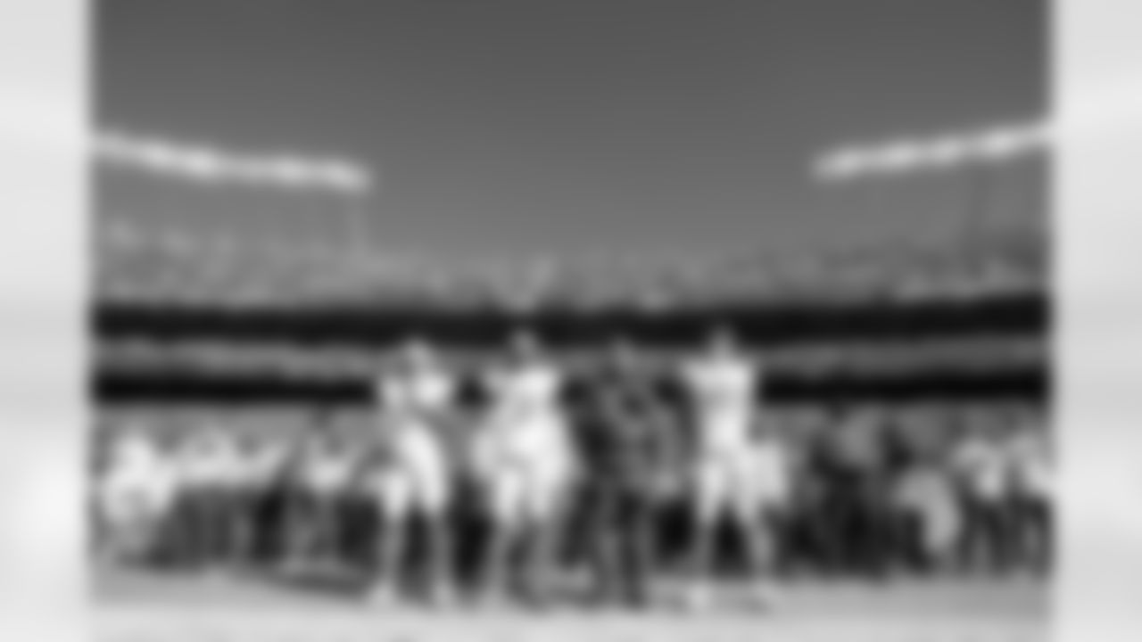 LB Daiyan Henley (0), S Derwin James Jr. (3), Head Coach Jim Harbaugh and QB Justin Herbert (10)