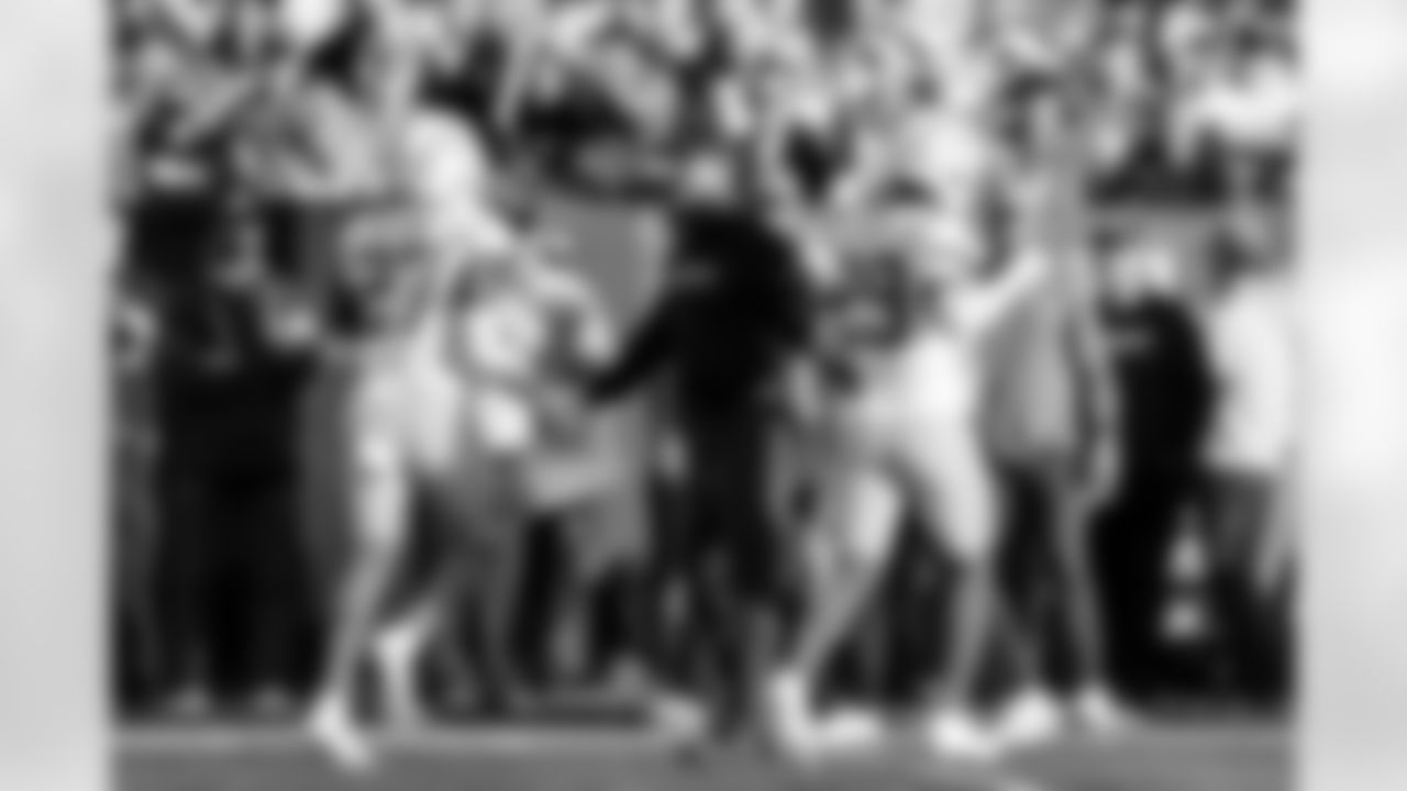 S RJ Mickens (27), Head Coach Jim Harbaugh and CB Tarheeb Still (29)