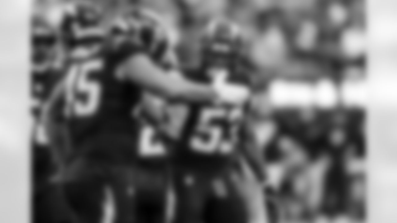 LB Marlowe Wax (58) and LB Del'Shawn Phillips (53)