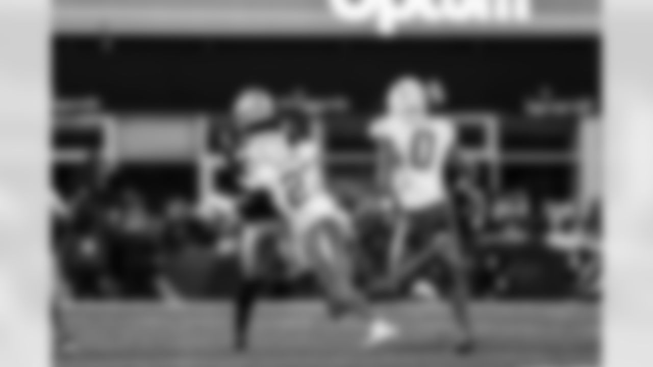 S RJ Mickens (27) and LB Daiyan Henley (0)