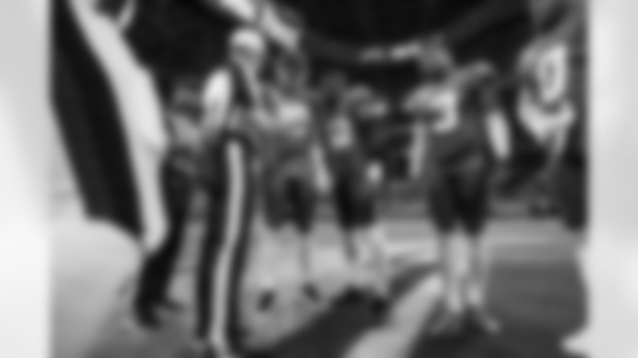 QB Justin Herbert (10) and OLB Khalil Mack (52)