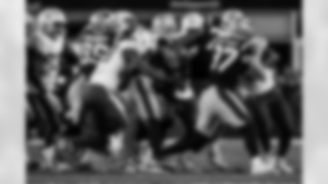 Check out the best shots from the Chargers Wild Card matchup against the Patriots!