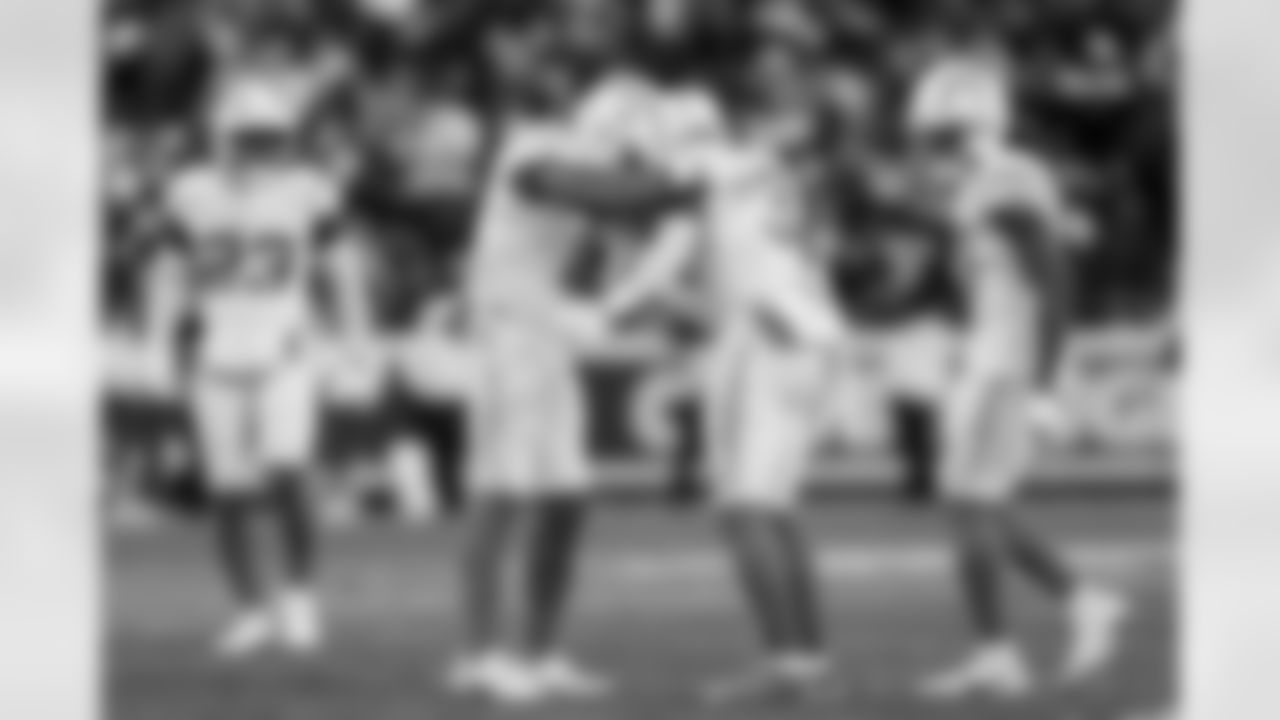 LB Daiyan Henley (0) and S Derwin James Jr. (3)