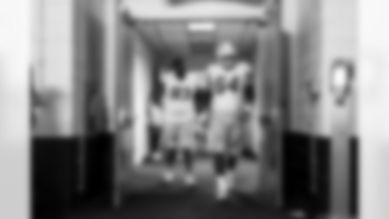 DL Otito Ogbonnia (93) and OL Trevor Penning (64)