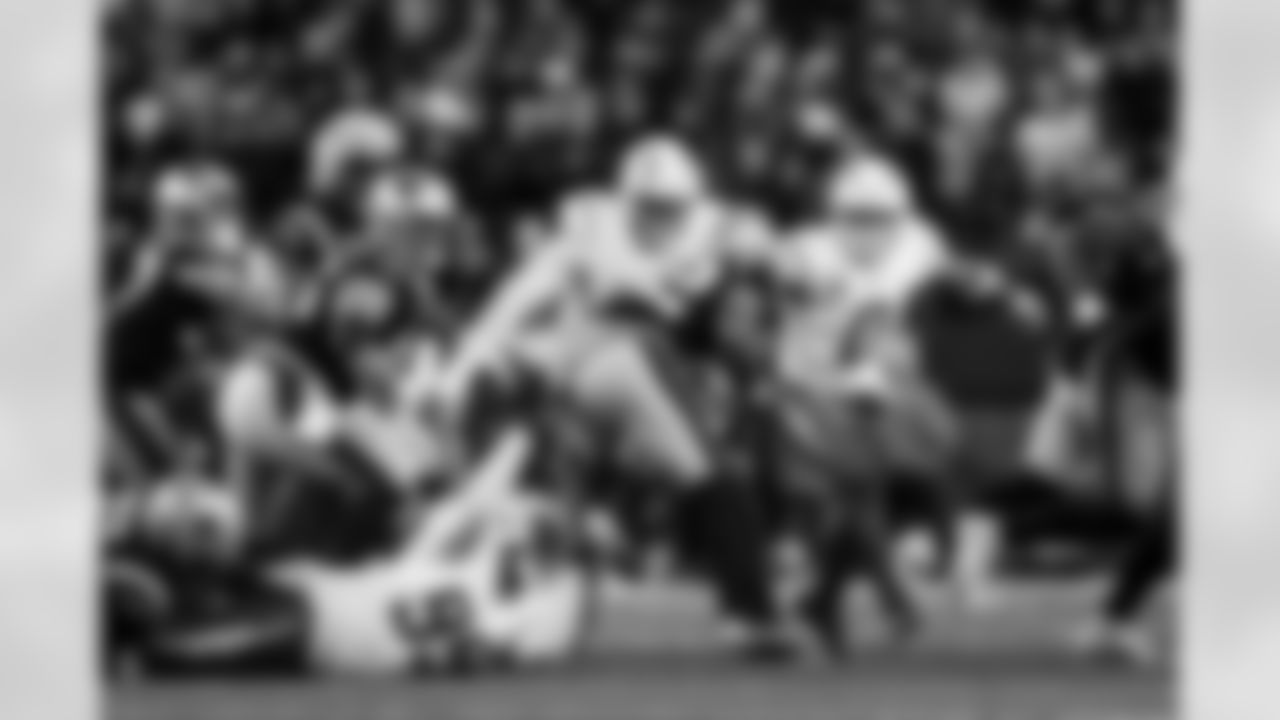 DT Jamaree Caldwell (99) and LB Daiyan Henley (0)