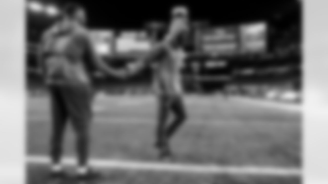 OLB Khalil Mack (52) and CB Cam Hart (20)