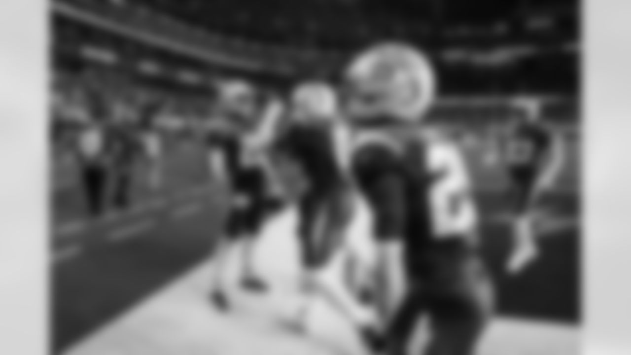 CB Cam Hart (20), LB Daiyan Henley (0) and CB Tarheeb Still (29)