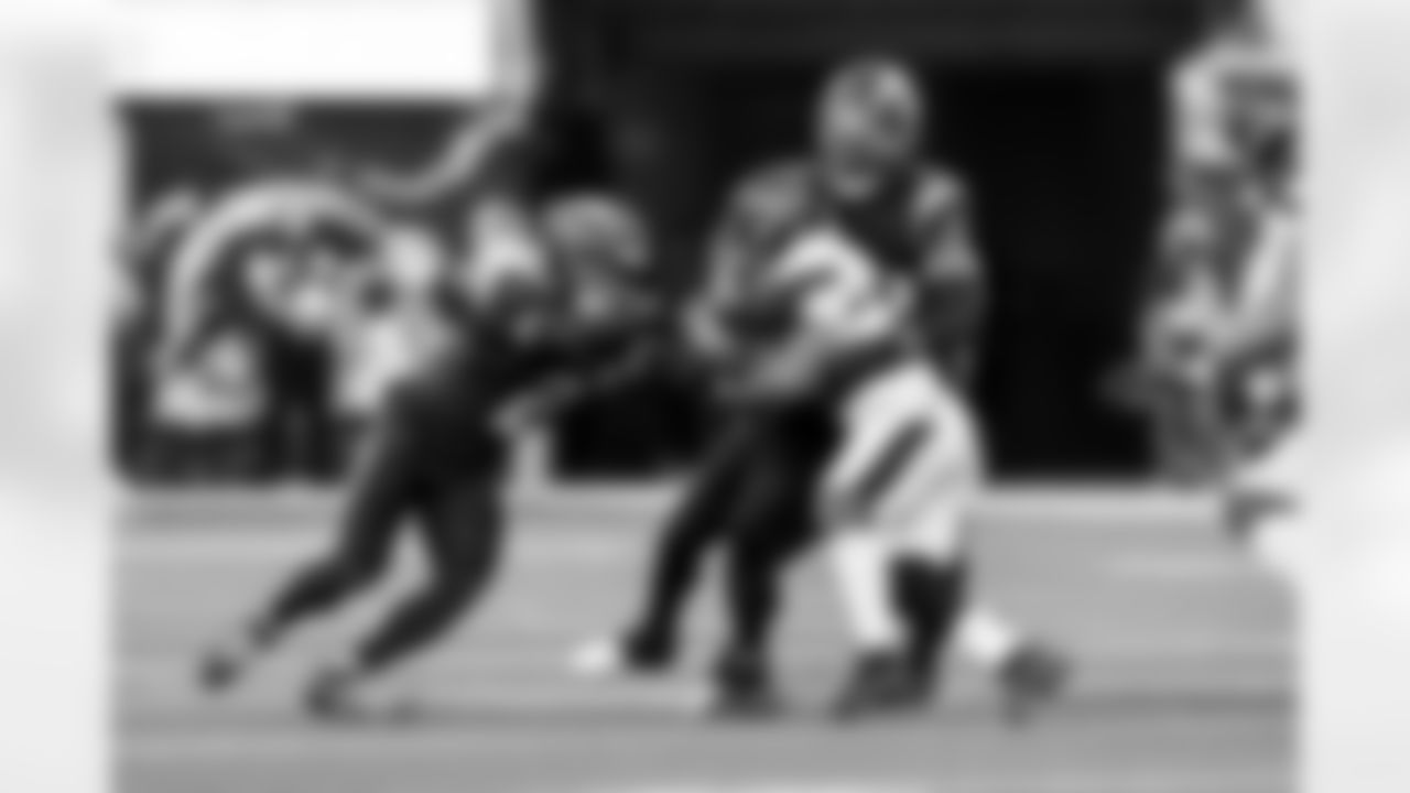 DB Elijah Molden (2) and OLB Odafe Oweh (98)