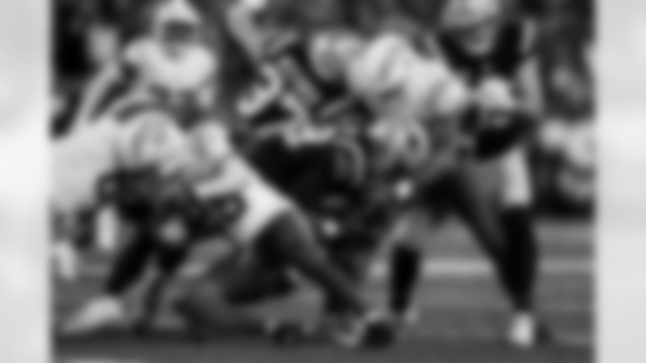 Check out the best shots from the Chargers Wild Card matchup against the Patriots!